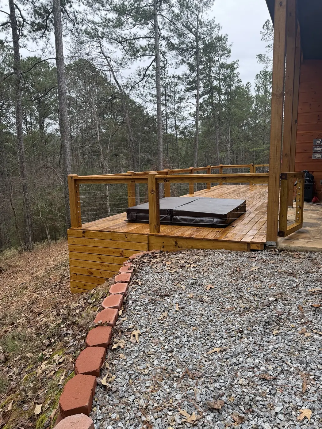 Hot tub deck area with cable railing